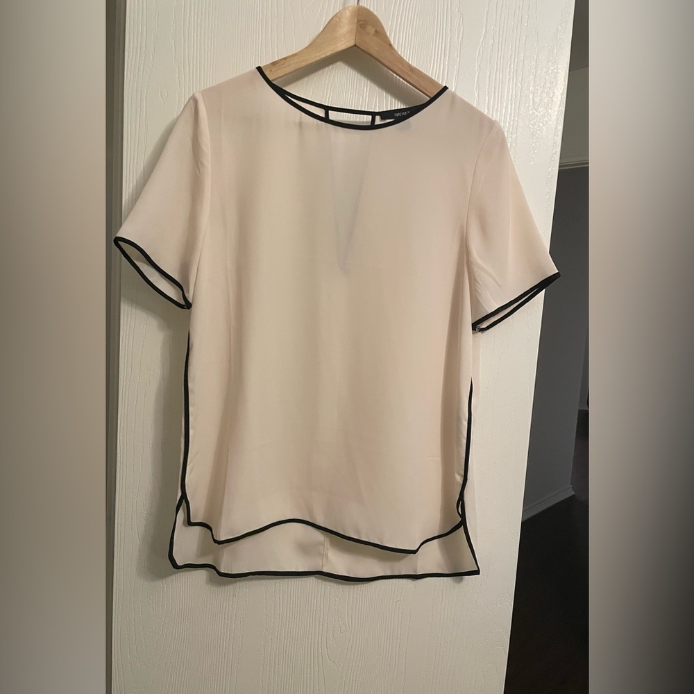 Classic blouse women’s size large in nude and black color with cutout on back